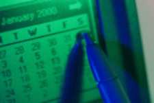 picture of a pen hovering over a date on a calendar
