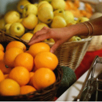 picture of a hand picking fruit